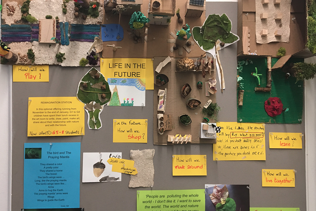 3D student work imagining life in the future with cardboard models and printed words