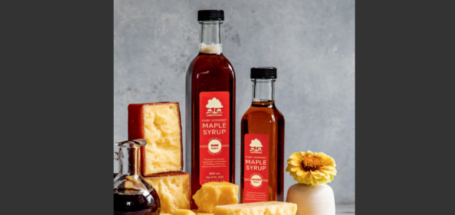 cover of catalog with photo of crumbled cheddar and maple syrup in tall glass bottles